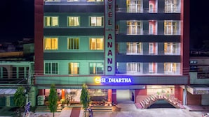A multi-story hotel with a prominent sign reading "HOTEL AND SIDDHARTHA."