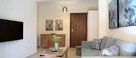 Deluxe Apartment, 2 Bedrooms, Balcony, City View | Living room | Flat-screen TV