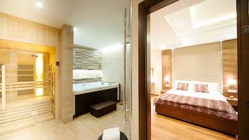 Habitación Deluxe | Zona de estar | Una televisión de pantalla plana