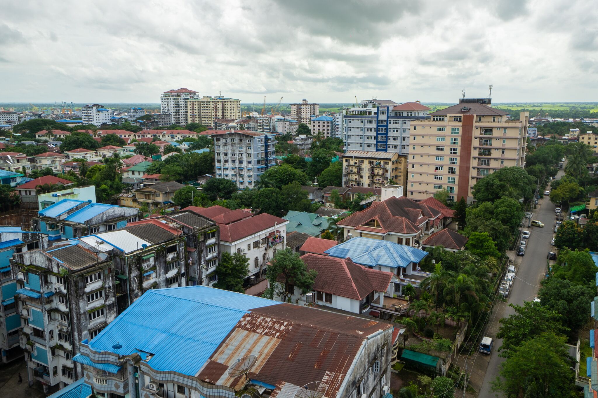 A densely built urban area with multi-story residential buildings, narrow streets, and a mix of older and newer structures.