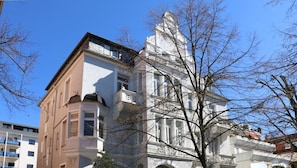 A historic building with classical architecture, including a prominent tower and detailed facade. - Wohnen Im Exklusiven Dichterviertel (Bad Nauheim)
