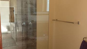 Shower, hair dryer, towels, toilet paper
