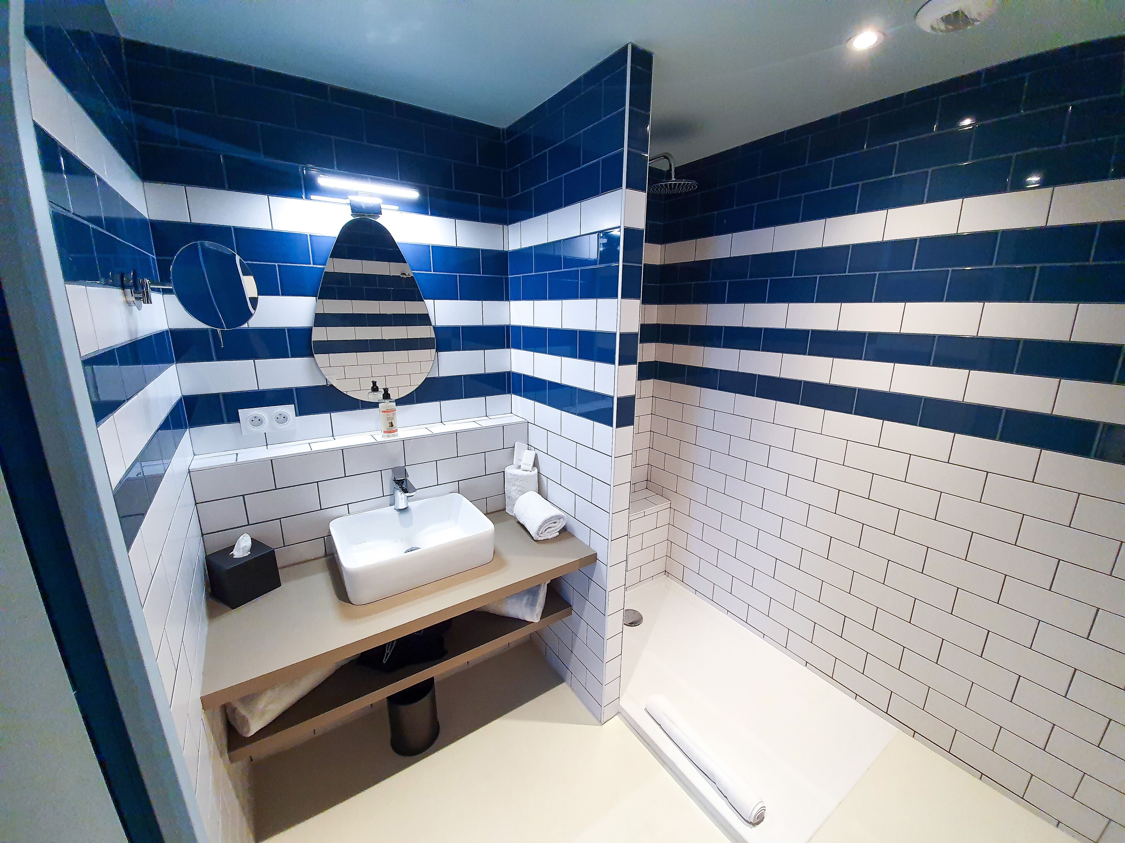 shower, hair dryer, bathrobes, slippers