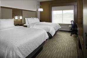 A hotel room with two beds, a desk, a chair, a nightstand, and a large window with a view.