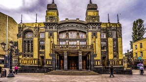 A historic building with ornate architecture, large windows, and a central entrance. - Yeshim Guest House (Baku)