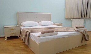 Premium bedding, blackout curtains, soundproofing, iron/ironing board