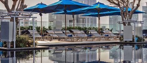Outdoor pool, pool umbrellas, sun loungers