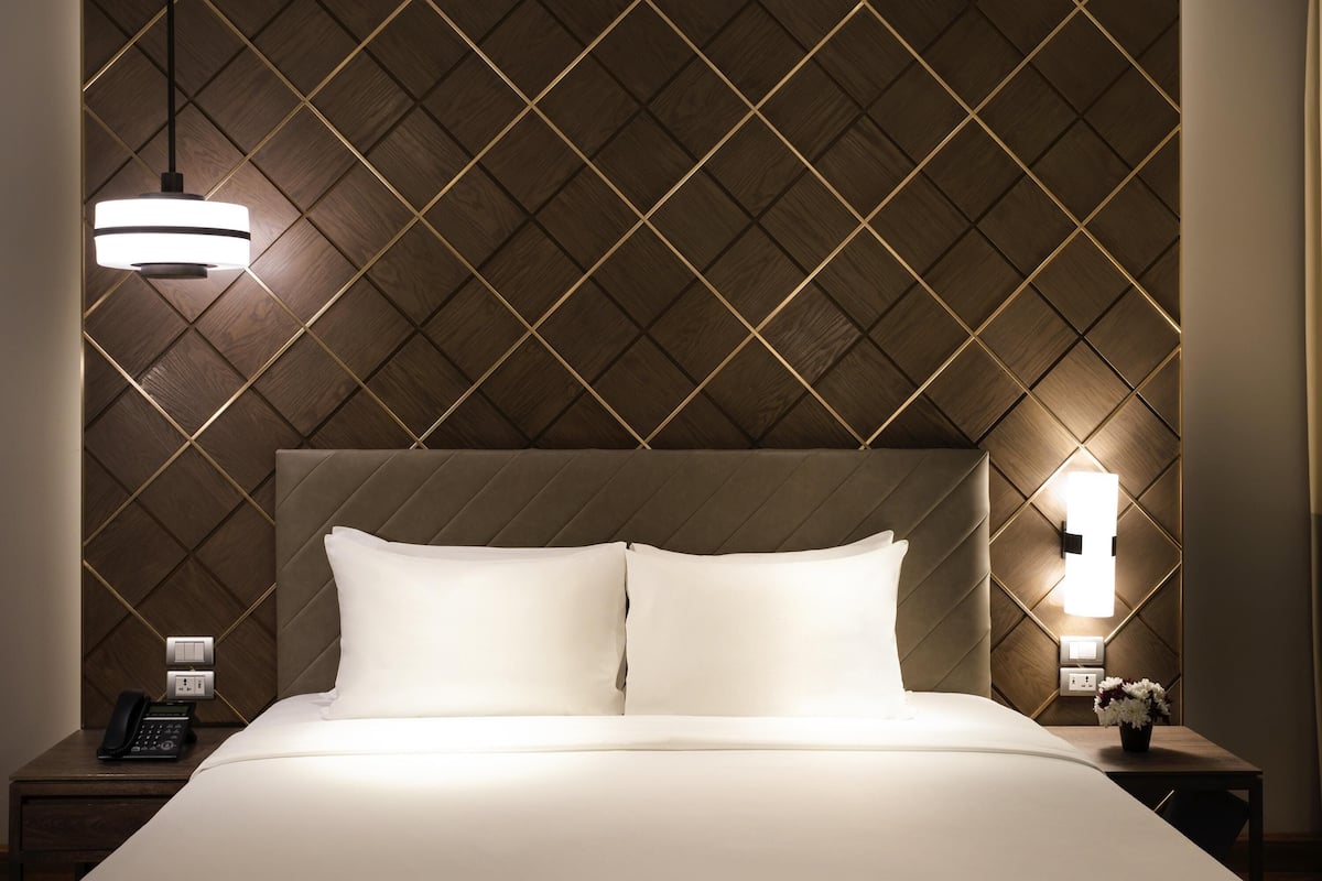 Deluxe Suite, 1 King Bed, City View | In-room safe, desk, laptop workspace, iron/ironing board