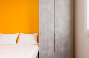 Triple Room, Multiple Beds | Living area | Flat-screen TV