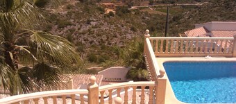 At the edge of a nature reserve, detached villa with pool &  view of sea