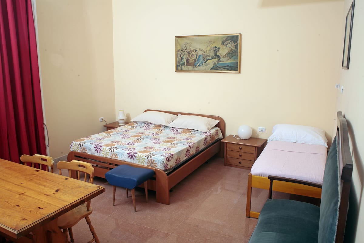 Triple Room, Shared Bathroom | Blackout curtains, iron/ironing board (on request), free WiFi