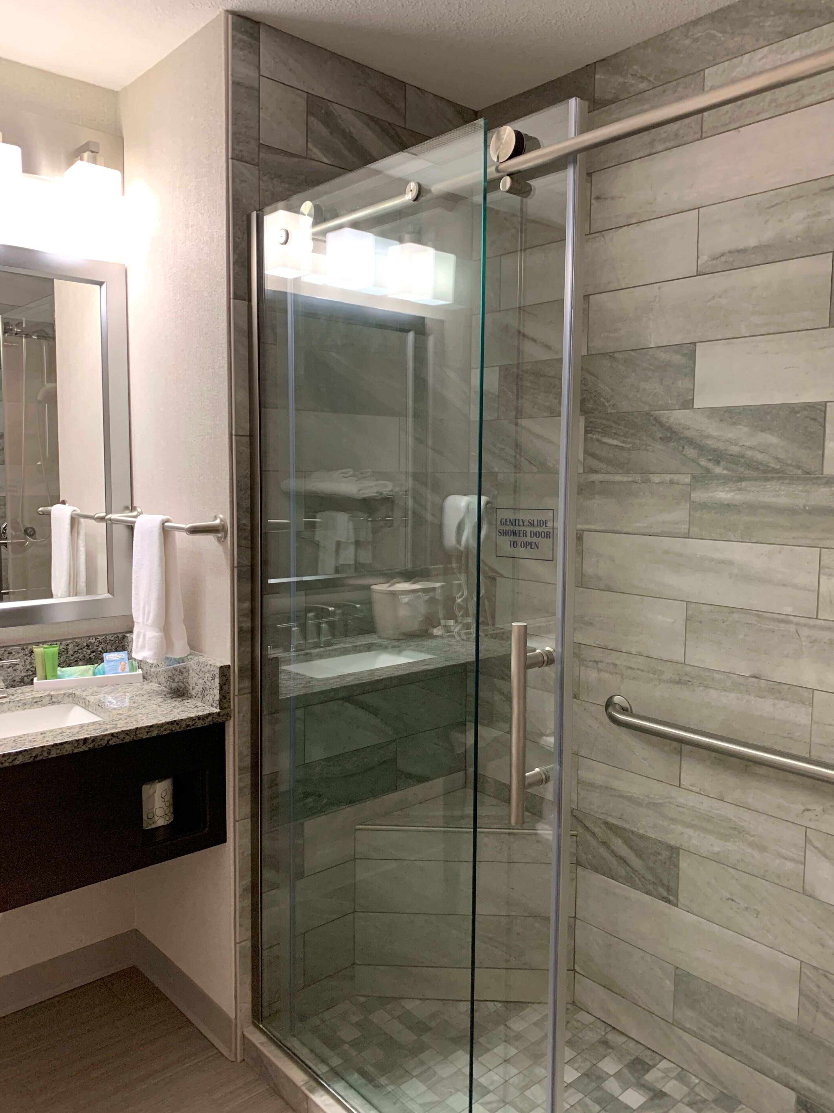 shower, free toiletries, hair dryer, towels