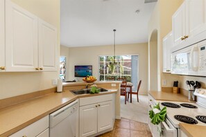 Fridge, microwave, dishwasher, cookware/dishes/utensils