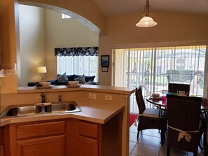 Fridge, dishwasher, coffee/tea maker, cookware/dishes/utensils