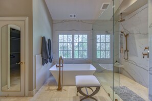 Bathtub, hair dryer, towels, soap