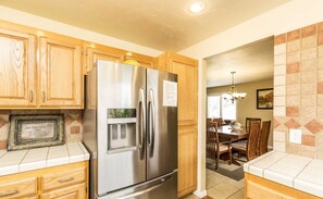 Enjoy meals in the kitchen, which offers a dining area with a table and chairs.