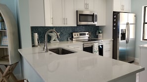 Fridge, microwave, oven, stovetop - Escape to your HAPPY place, luxury corner condo right on the beach! (Jensen Beach)
