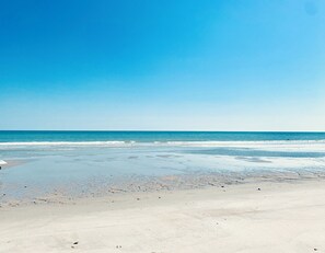 A beach with clear skies and calm waters. - Beautiful beach Condo with ocean and pool view, very family oriented.  (Myrtle Beach)