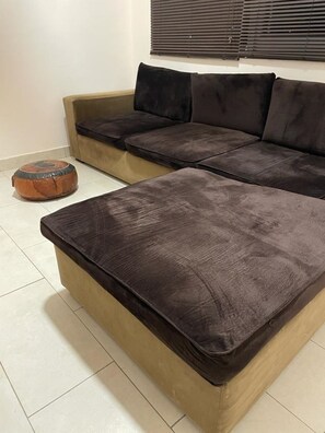 Relax in this stylish living room with a comfortable sectional sofa and matching ottoman.