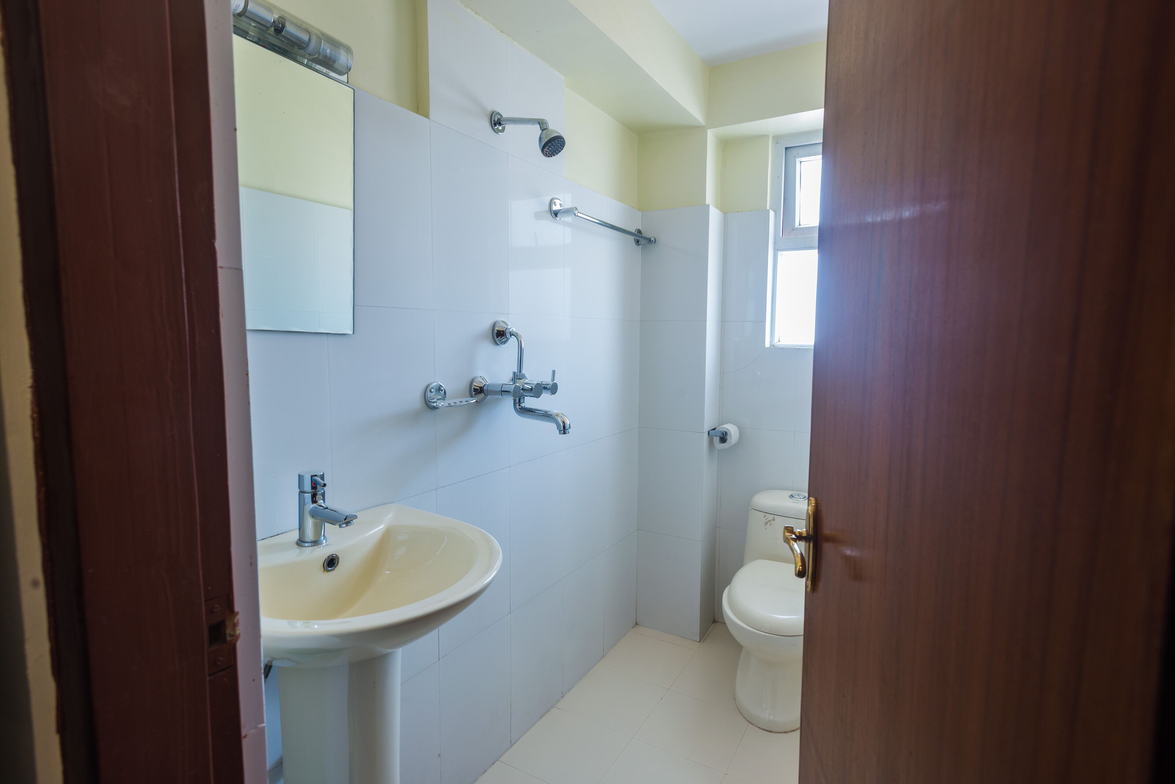 A bathroom with a sink, toilet, and shower.