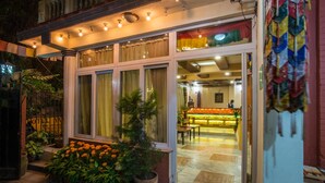 A hotel entrance with a tiled floor, a potted plant, and a signboard. - Hotel Yambu (Kathmandu)