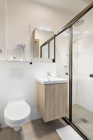 Shower, rainfall showerhead, hair dryer, towels