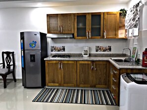 Fridge, microwave, stovetop, coffee/tea maker