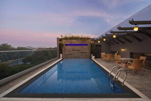 Outdoor pool, open 7:00 AM to 7:00 PM, pool loungers - The Fern Residency Bhopal, Series by Marriott (Bhopal)