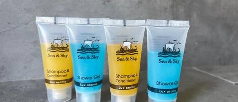 Four tubes of Sea & Sky shampoo and conditioner, and shower gel, each labeled with 'Lux aroma'.