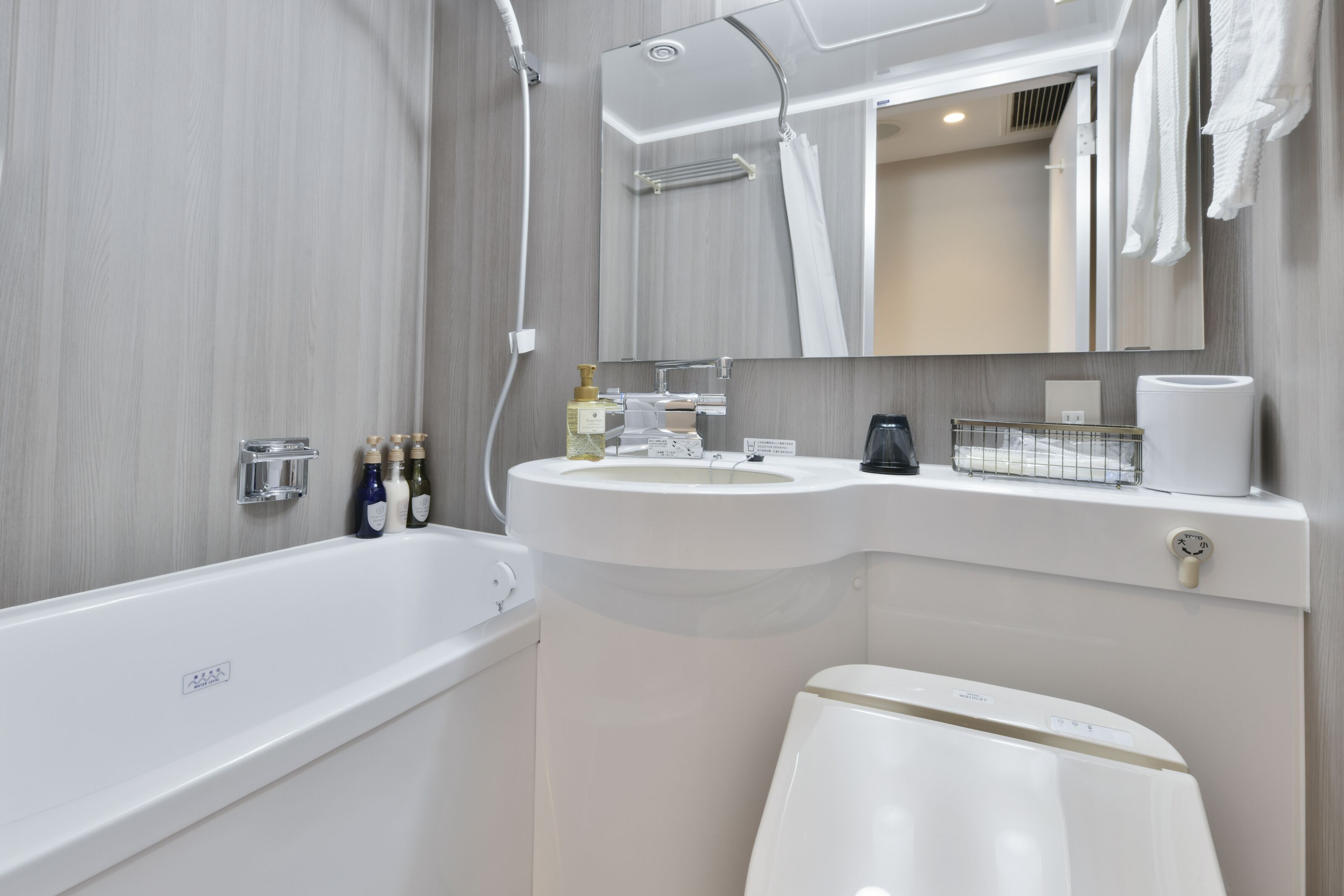 combined shower/bathtub, free toiletries, hair dryer, slippers