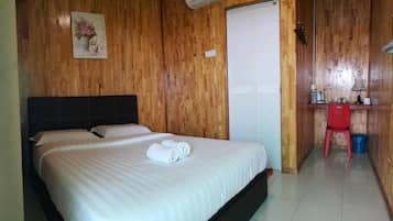 Desk, iron/ironing board, bed sheets
