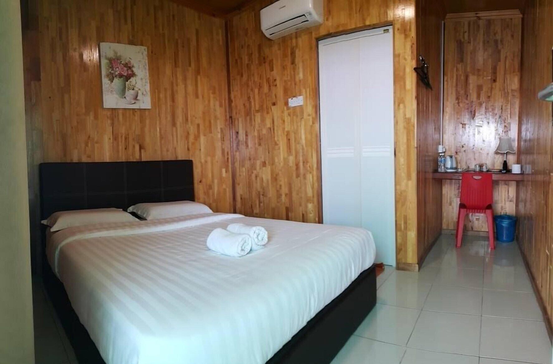 Desk, iron/ironing board, bed sheets