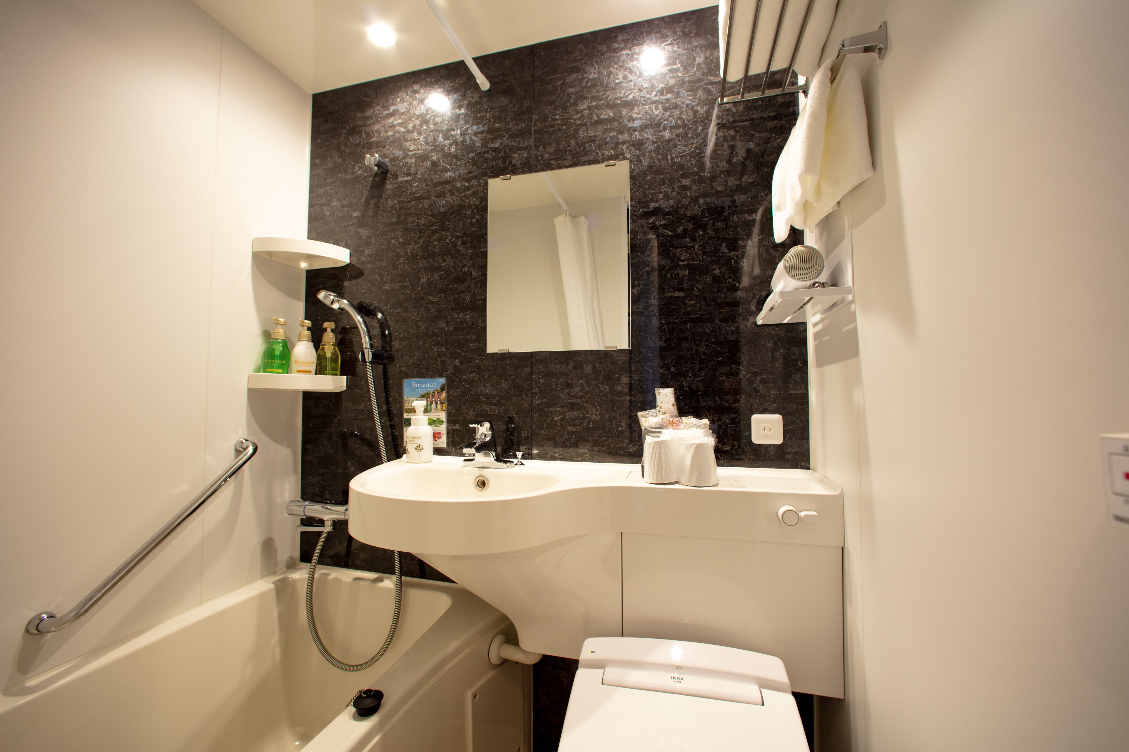 combined shower/bathtub, free toiletries, hair dryer, dressing gowns