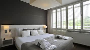 Deluxe Suite | 1 bedroom, hypo-allergenic bedding, in-room safe, individually decorated