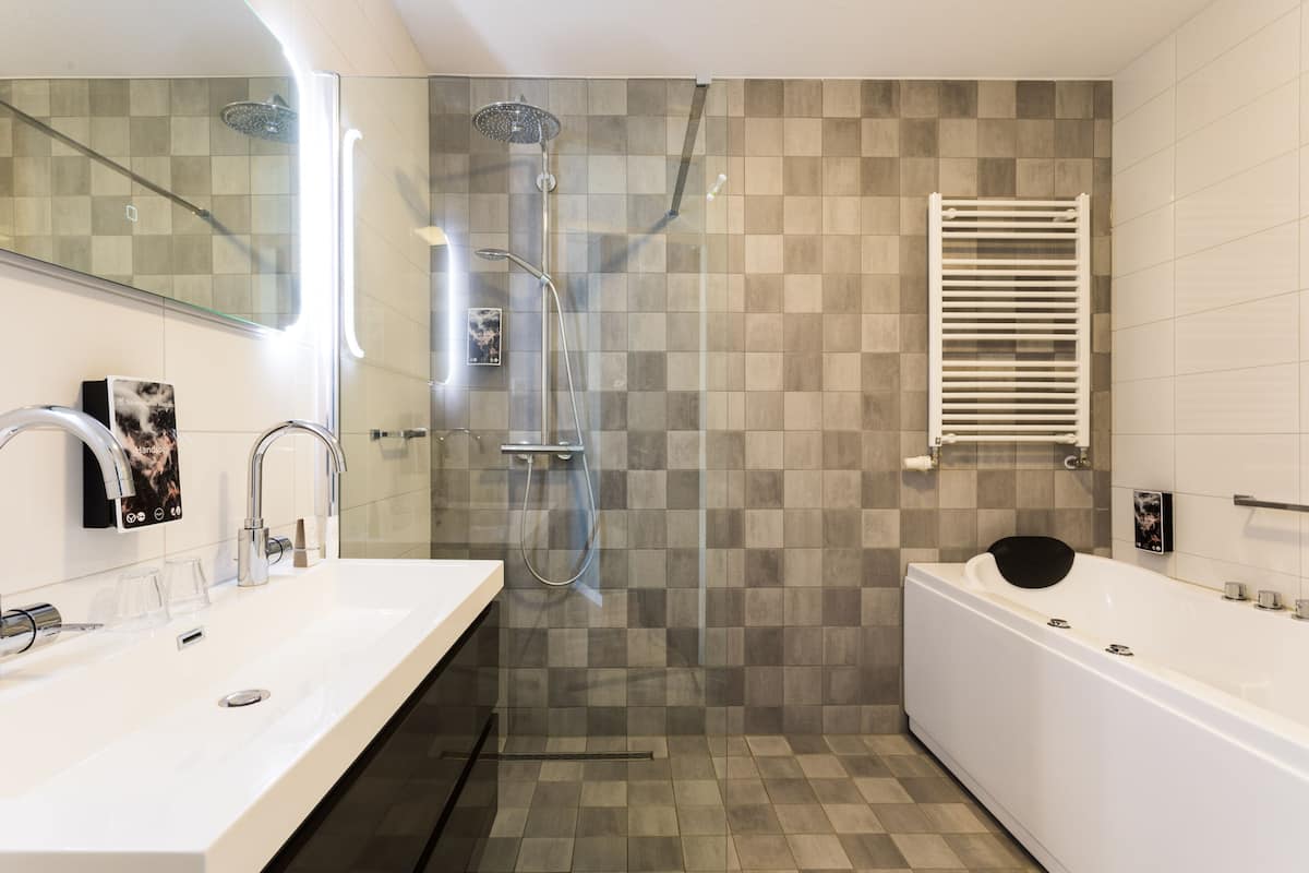 deluxe suite | bathroom | free toiletries, hair dryer, bathrobes, slippers