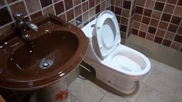 Shower, slippers, towels, soap