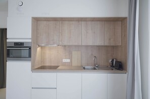 Suite estudio Deluxe | Cocina privada | Horno, parrilla de estufa, lavavajillas y cafetera de espresso 