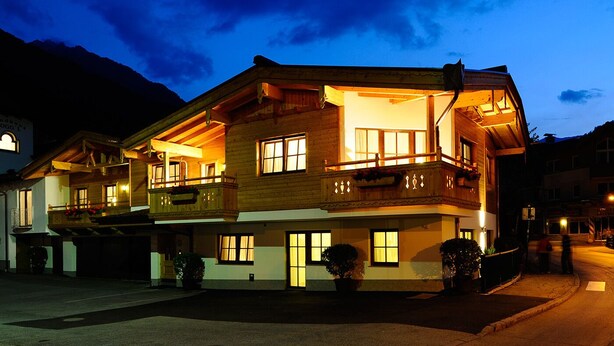 A multi-story wooden building with balconies and large windows, likely a hotel or guesthouse. - Hotel Viktoria & Landhaus Joggl (Mayrhofen)