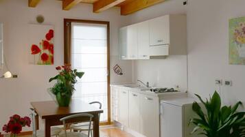 Apartment, 1 Bedroom (2 Adults) | Private kitchen | Full-sized fridge, stovetop, high chair, cookware/dishes/utensils