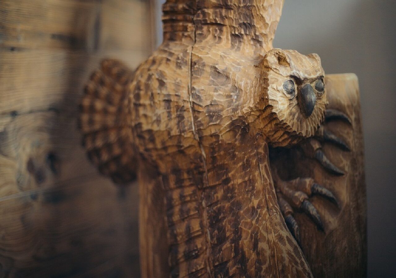 A close-up of a wooden sculpture with detailed carvings.