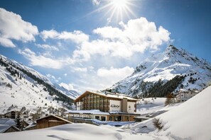 A snow-covered mountain resort with a prominent building labeled "Almhof." - Hotel Almhof (Galtur)