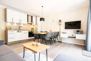 Family Apartment, 2 Bedrooms, Patio | Living area | Flat-screen TV - AKZENT Apartmenthotel Binz (Binz)