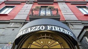 A building facade with a prominent entrance labeled "PALAZZO FIRENZE". - Palazzo Firenze (Naples)