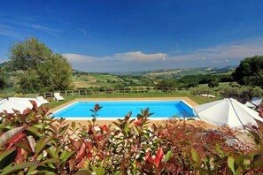 Seasonal outdoor pool, pool umbrellas