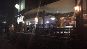 A restaurant named Buddy's Garden with outdoor seating and a visible entrance. - Buddy Guesthouse (Chiang Mai)