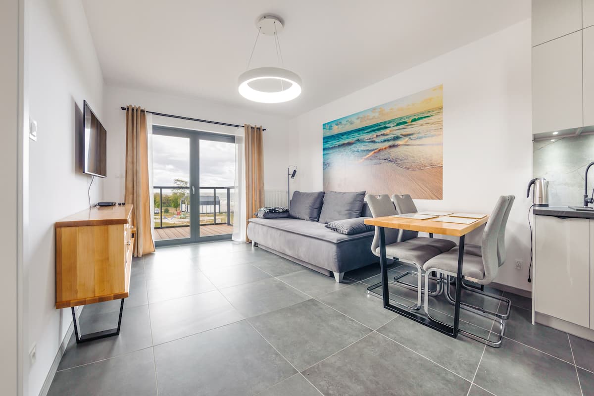 Apartment (31 - ul. Kaprala Koniecznego 7) | Living area | Flat-screen TV