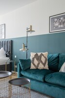 Suite (L with sofa bed) | Living area | Flat-screen TV