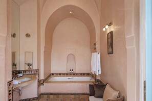 Bathtub, hair dryer, towels, soap