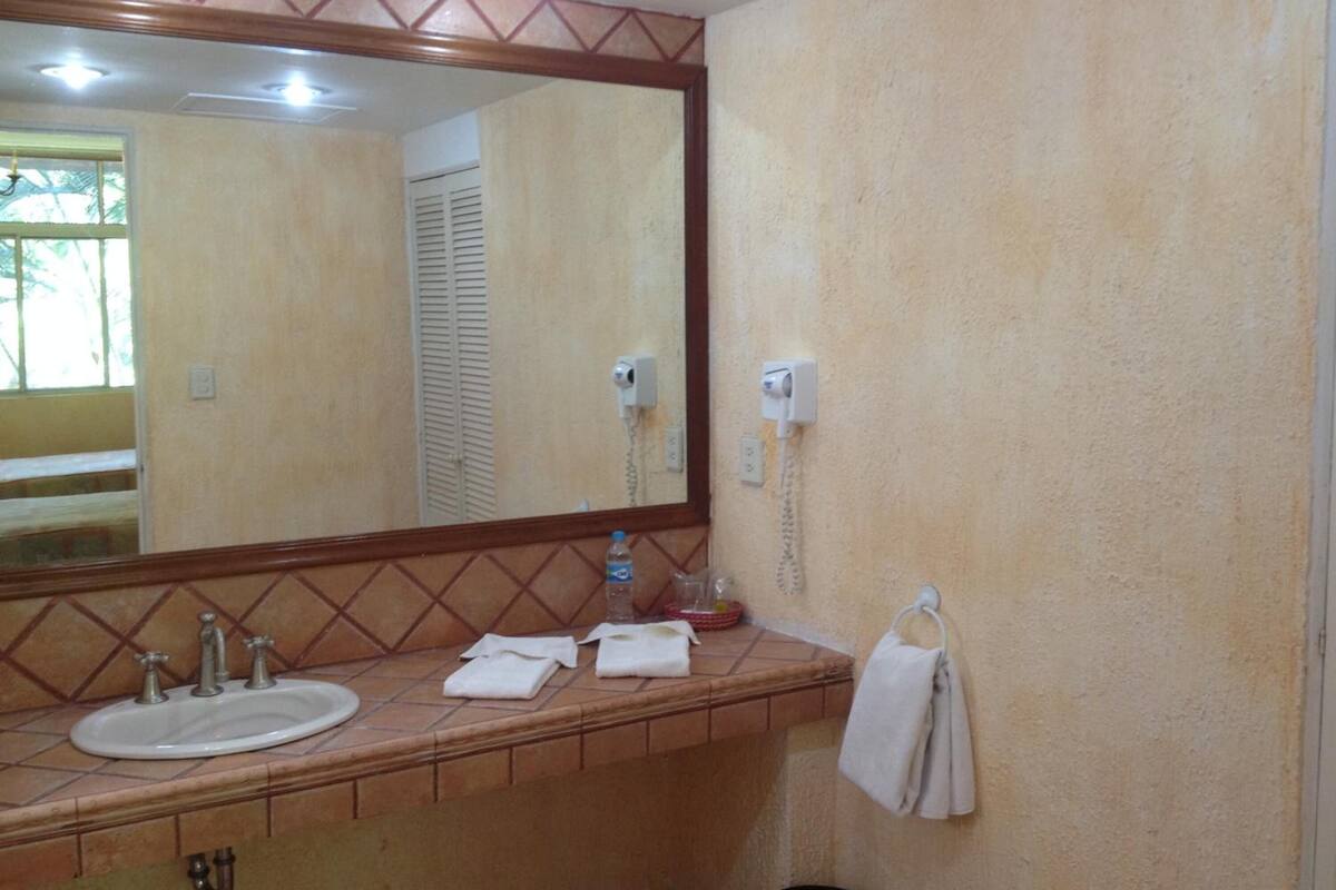 shower, rainfall showerhead, hair dryer, towels