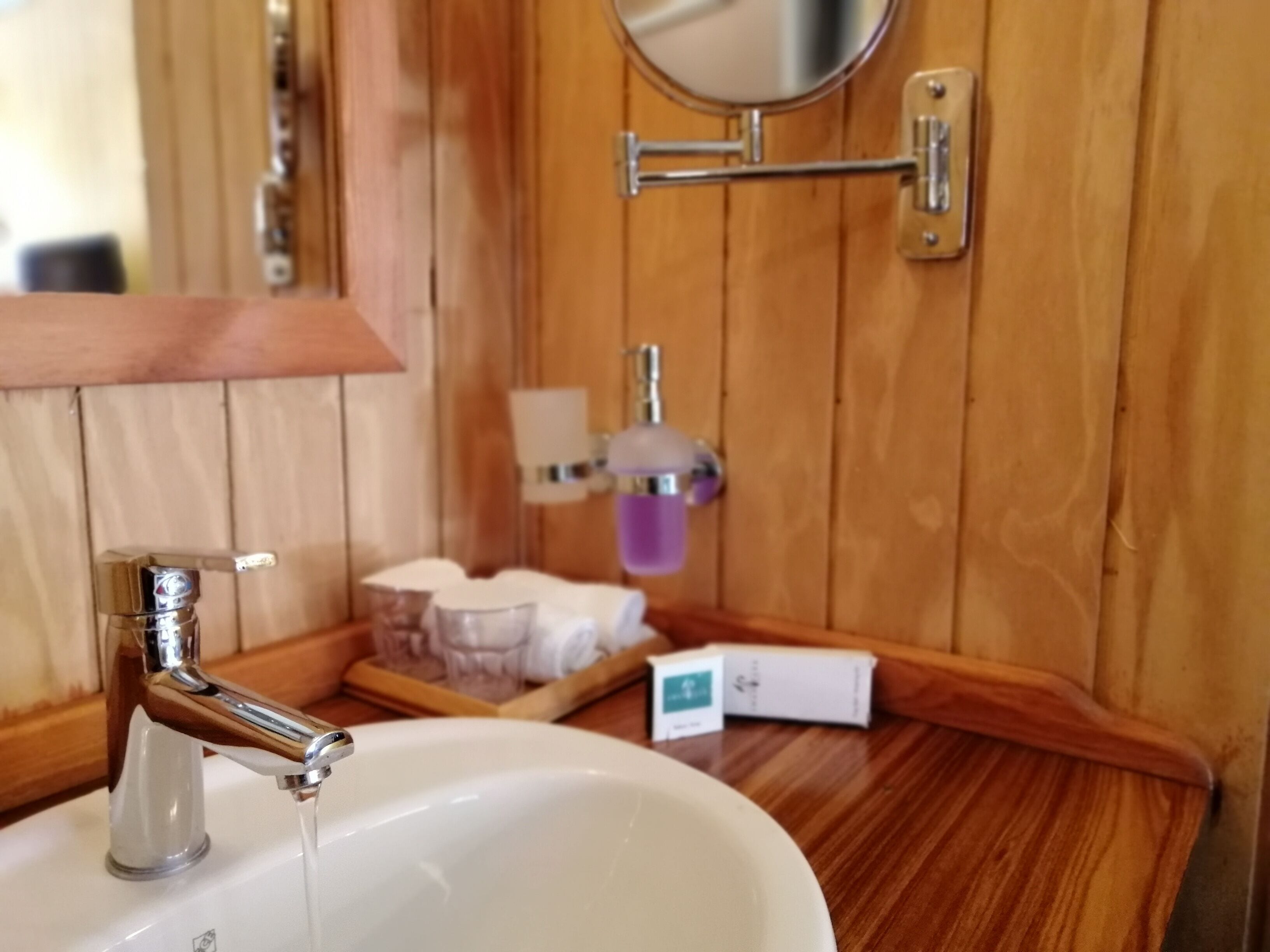 stone bungalow | bathroom | free toiletries, hair dryer, bathrobes, slippers